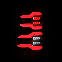 Thumbnail for AlphaRex 09-18 Dodge Ram Luxx-Series LED Tail Lights Black w/ Activation Light & Sequential Signal