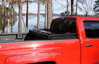 Thumbnail for Lund 04-06 Chevy Silverado 1500 Fleetside (5.8ft. Bed) Hard Fold Tonneau Cover - Black